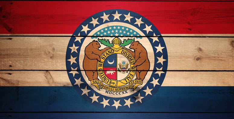 Missouri flag on wooden background