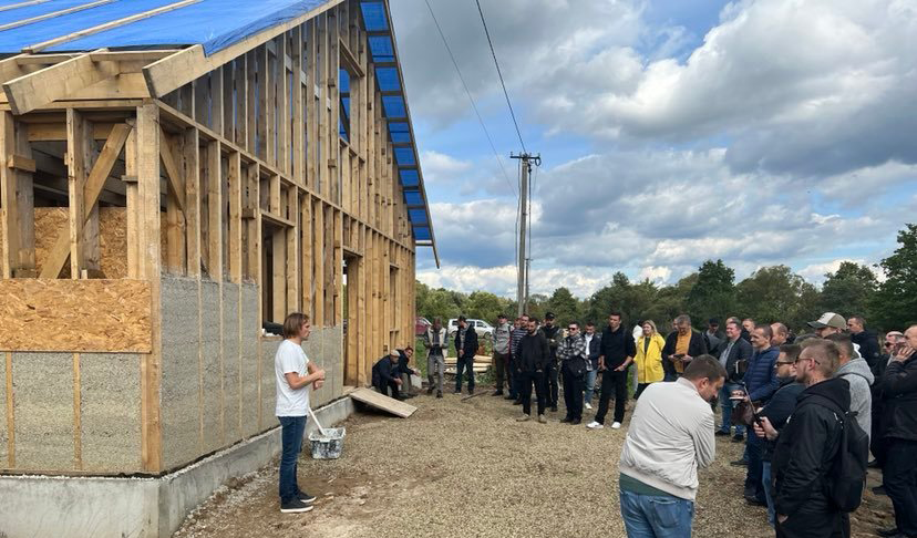 Sergiy Kovalenkov, left, leads a training session at the Morshyn building site.